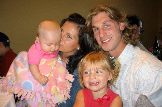 Former Edmonton Oilers player Ryan Smyth is comforted by his wife